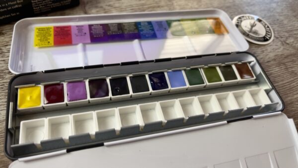 Open box of Daniel Smith watercolour half pan set. The colours of inspiration.